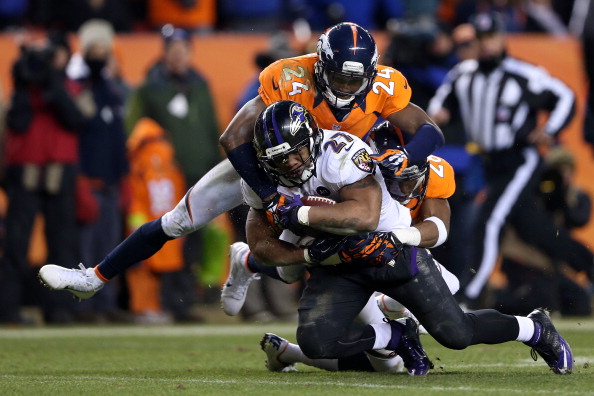 DENVER, CO - JANUARY 12:  Ray Rice #27 of the Baltimore Ravens is tackled by Champ Bailey #24 of the Denver Broncos during the AFC Divisional Playoff Game at Sports Authority Field at Mile High on January 12, 2013 in Denver, Colorado.  (Photo by Jeff Gross/Getty Images) 