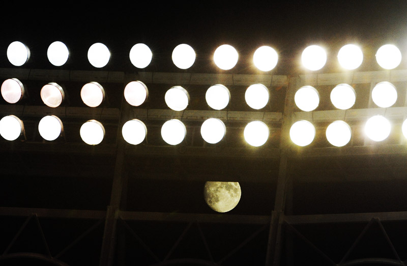 CHICAGO, IL - JULY 30: A view of the moon shining through the lights during the game between the Chicago Cubs and the Pittsburgh Pirates on July 30, 2012 at Wrigley Field in Chicago, Illinois.