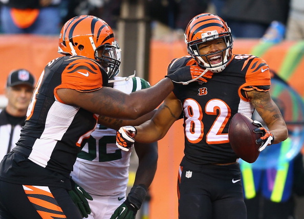 CINCINNATI, OH - OCTOBER 27:  Marvin Jones #82 of the Cincinnati Bengals celebrates with Anthony Collins #73 (left) after scoring a touchdown during the NFL game against the New York Jets at Paul Brown Stadium on October 27, 2013 in Cincinnati, Ohio.  (Photo by Andy Lyons/Getty Images)