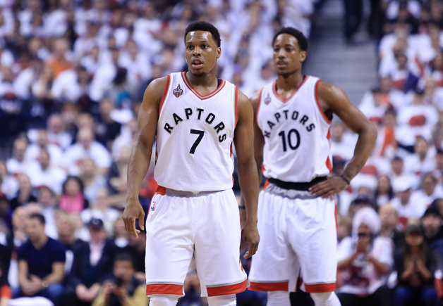 Kyle Lowry #7 and DeMar DeRozan #10 of the Toronto Raptors look on in the first half of Game Seven of the Eastern Conference Quarterfinals against the Miami Heat during the 2016 NBA Playoffs at the Air Canada Centre on May 15, 2016 in Toronto, Ontario, Canada.
