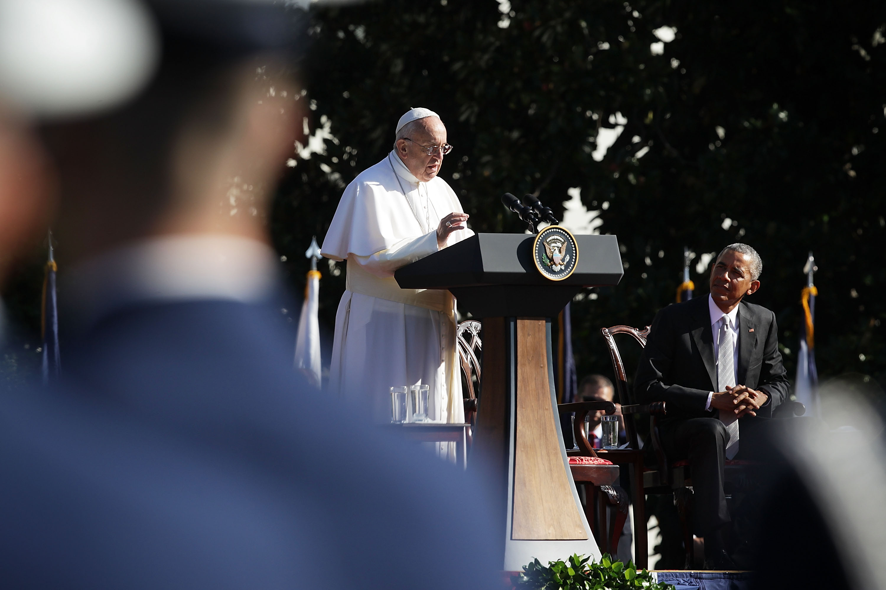 Pope Francis speaks as U.S. President Barack Obama listens during the arrival ceremony at the White House on September 23, 2015 in Washington, DC. The Pope began his first trip to the United States at the White House. (Photo by Alex Wong/Getty Images)