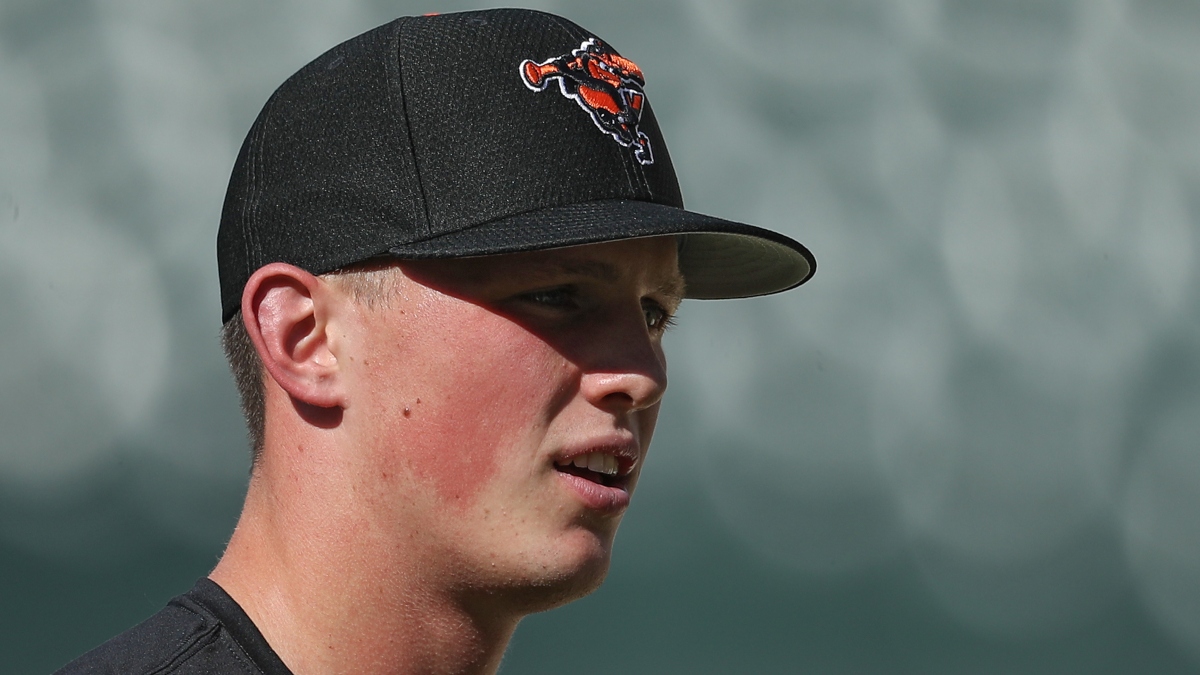 Adleyrutschman #35 of the Baltimore Orioles, the top overall pick in 2019 Major League Baseball Draft, looks on before the Orioles play the San Diego Padres at Camden Yards at Oriole Park on June 25, 2019 in Baltimore, Maryland.